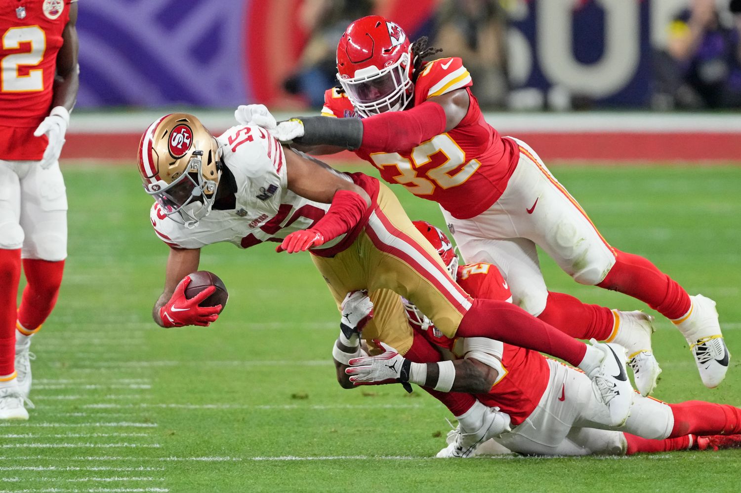 Feb 11, 2024; Paradise, Nevada, USA; Kansas City Chiefs safety Mike Edwards (21) and linebacker Nick Bolton (32) tackle San Francisco 49ers wide receiver Jauan Jennings (15) during the third quarter of Super Bowl LVIII at Allegiant Stadium. Mandatory Credit: Kyle Terada-USA TODAY Sports